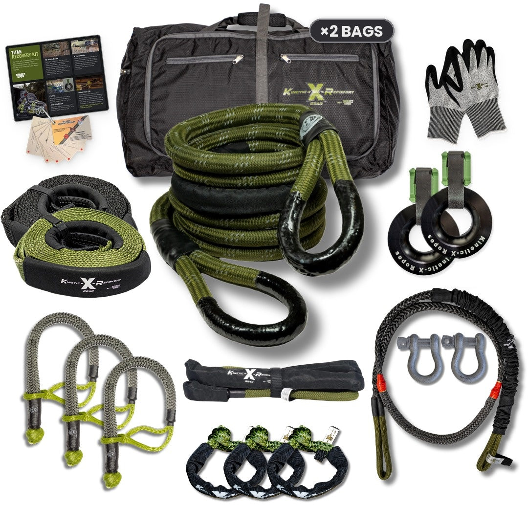Titan Pro Recovery Kit laid out: bag, kinetic rope, 3 Hitch Heros, 3 soft shackles, static bridle, Hero Bridle, 2 D-ring shackles, 2 pulleys with Anti-Tip Blocks, 20' snatch strap, 20' tow strap, gloves and guide cards. Ships with two black bags.