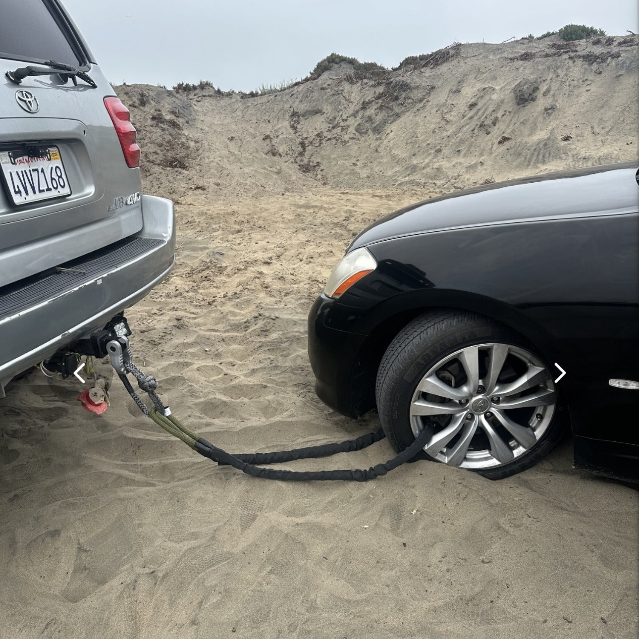 Hero Bridle run from a hitch through the wheel of a sedan stuck in sand