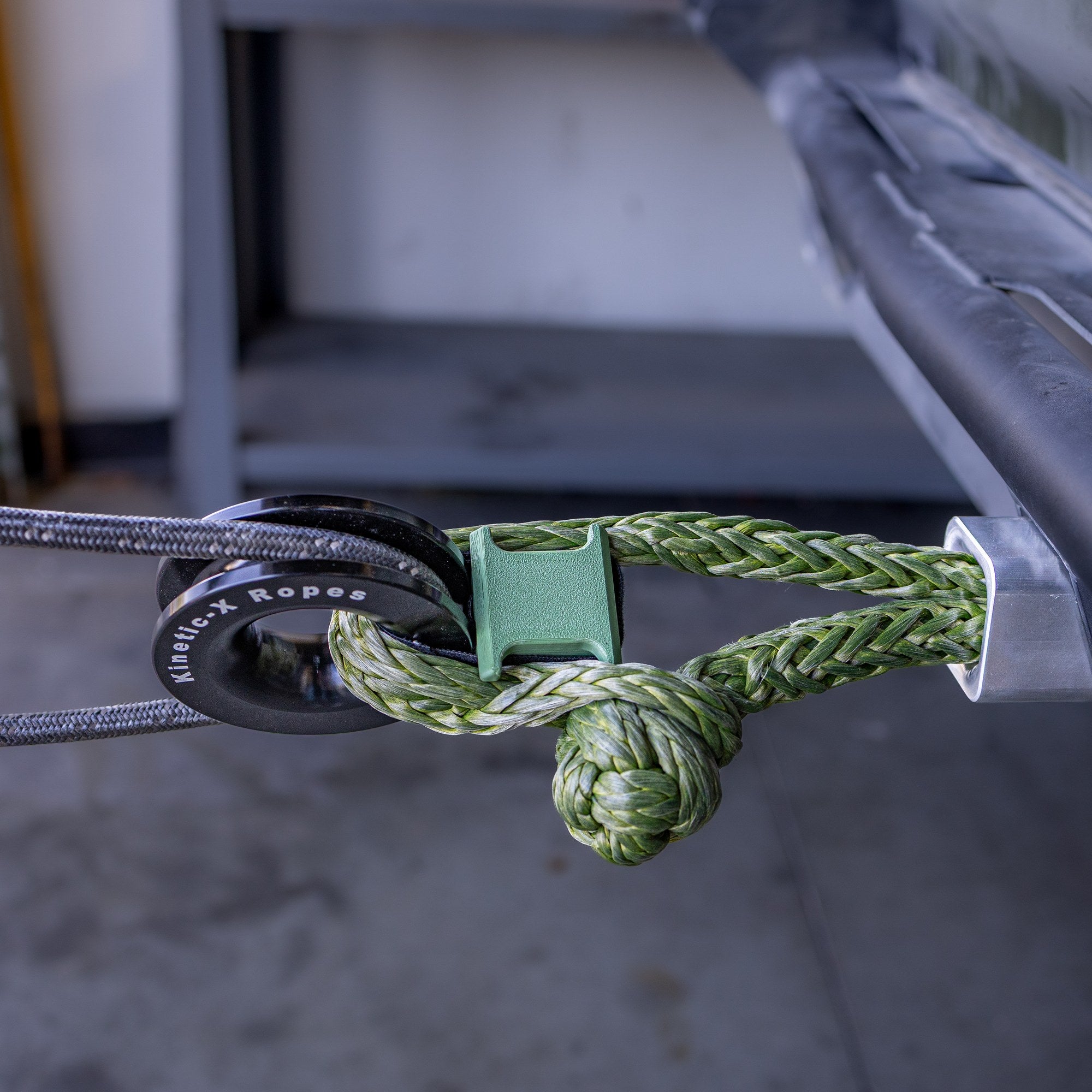 Anti-Tip block holding a Sandy Cats pulley on a soft shackle in a hitch receiver, winch line running through the pulley