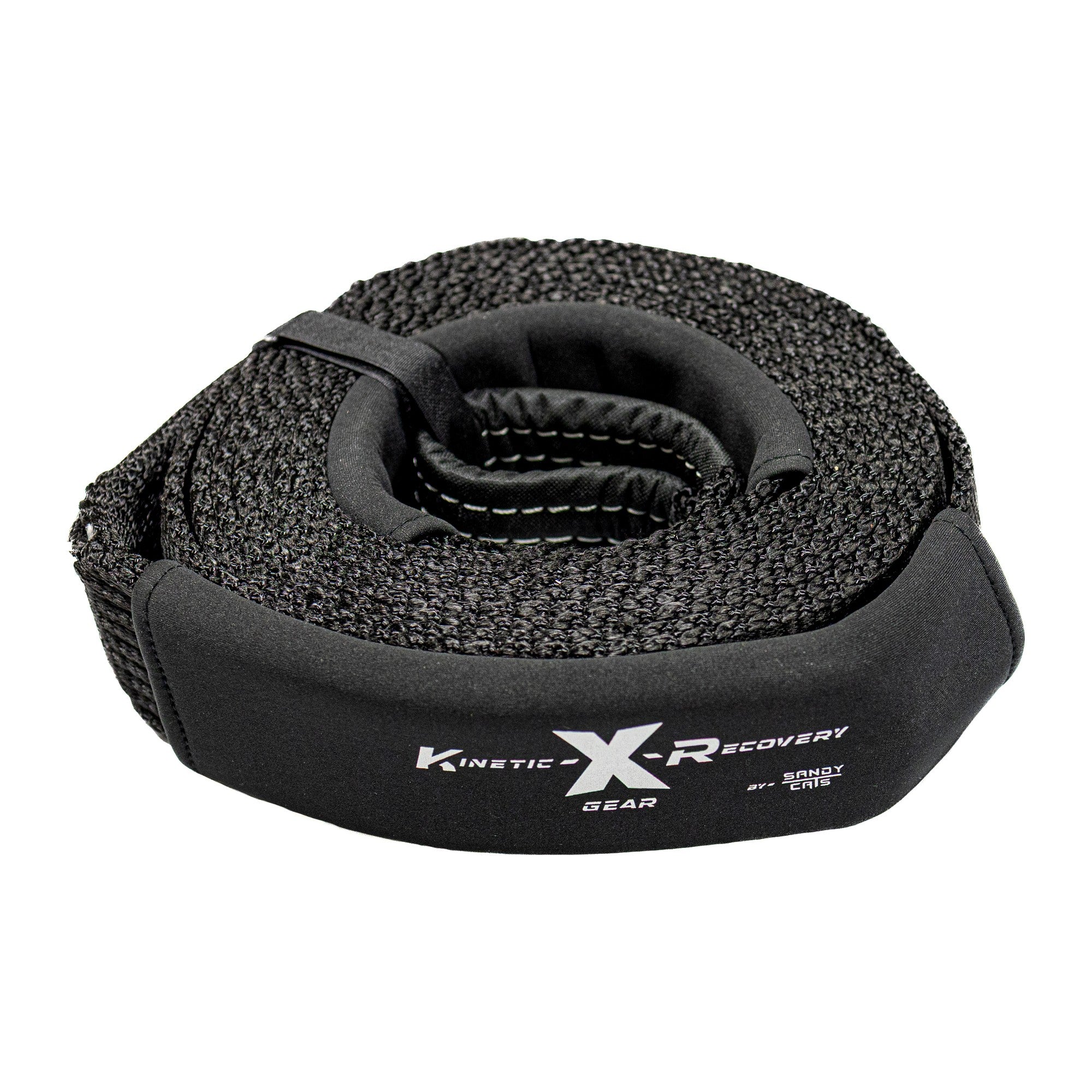 Sandy Cats snatch strap, 3 inch by 20 foot black nylon, coiled with the Kinetic-X label showing