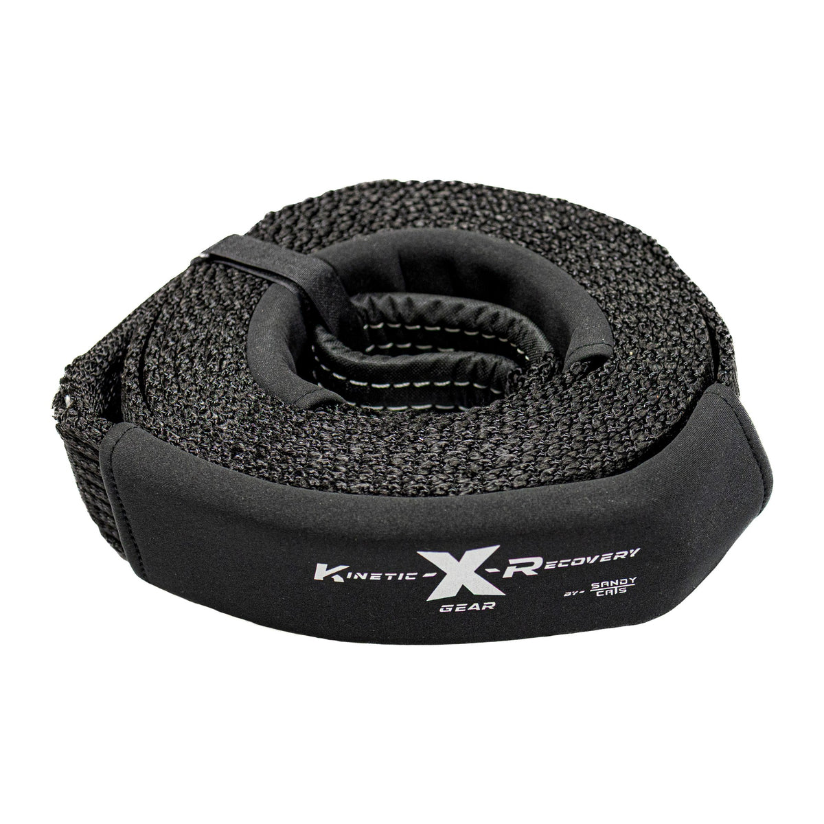 Sandy Cats snatch strap, 3 inch by 20 foot black nylon, coiled with the Kinetic-X label showing