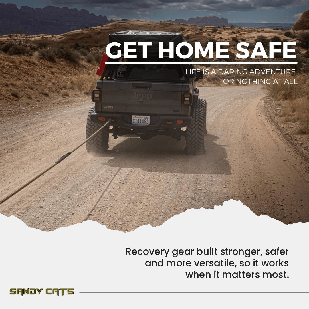 Get Home Safe: a Jeep towing with a kinetic recovery rope on a dirt trail, with the Sandy Cats message about reliable recovery gear.