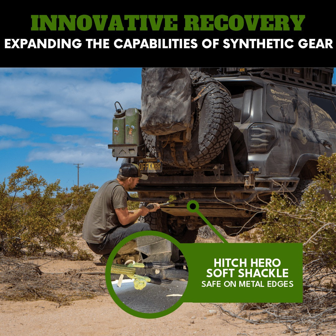 Man attaching a Hitch Hero Soft Shackle to a metal hitch receiver, demonstrating its safe use directly against metal edges with an overland rig in the background.