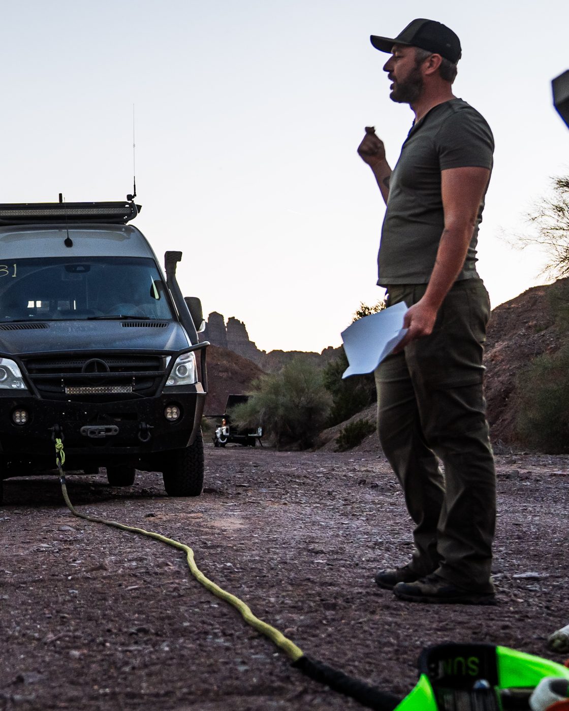 Sandy Cats founder teaching an off-road recovery clinic, with a kinetic rope rigged to a Sprinter van